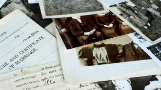 Scattering of old photos and other family history documents.