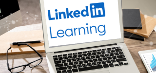 Laptop open to a page that reads LinkedIn Learning